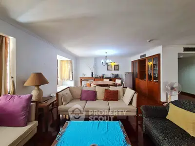 Spacious living room with elegant decor and cozy seating area, perfect for relaxation and entertaining.