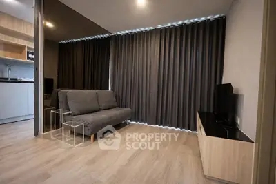 Modern living room with sleek design and cozy sofa, perfect for relaxation.