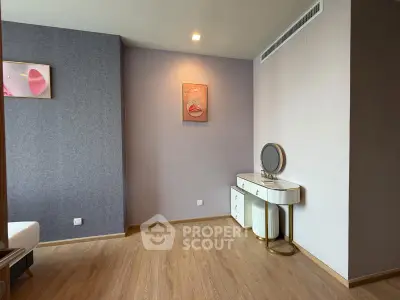 Stylish bedroom with modern decor and elegant vanity in a contemporary apartment.