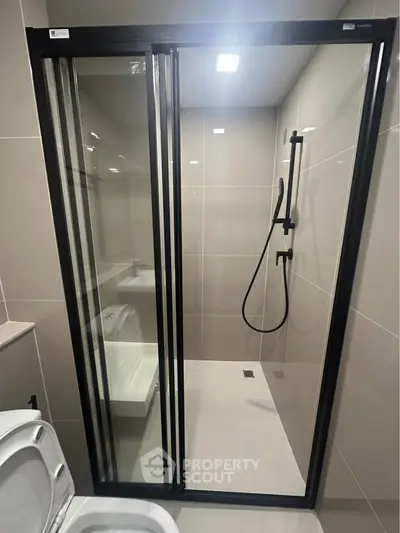 Modern bathroom with sleek shower enclosure and contemporary fixtures