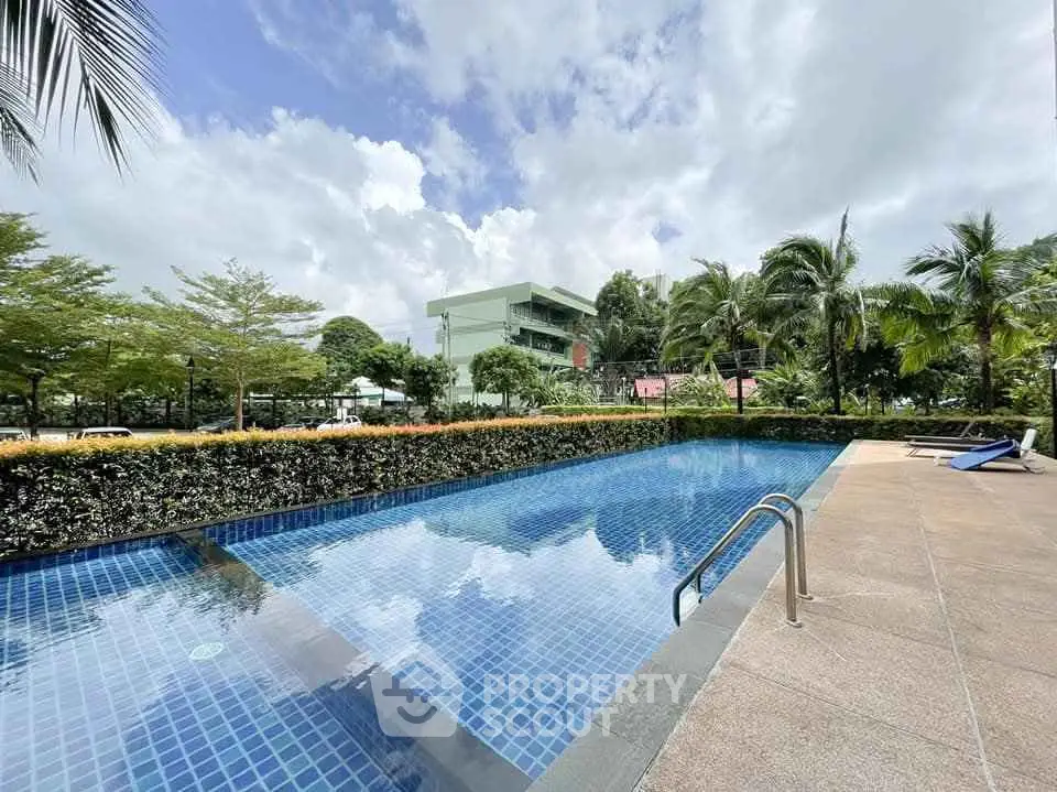 Stunning outdoor pool with lush greenery and modern architecture