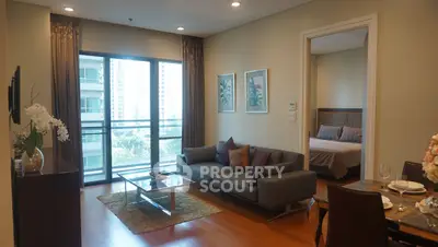 Modern living room with balcony view and elegant decor in urban apartment