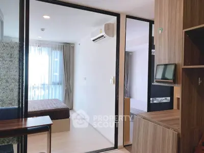 Modern bedroom with large window and air conditioning in stylish apartment