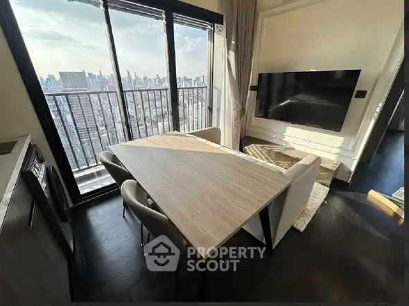 Modern living room with city view, sleek furniture, and large TV, perfect for urban living.