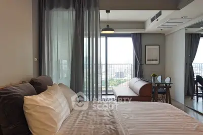 Modern bedroom with balcony view in stylish apartment