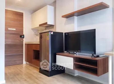 Modern compact kitchen with sleek appliances and stylish wooden accents