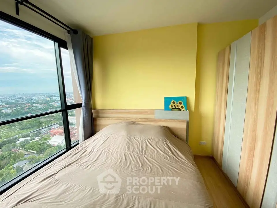 Cozy bedroom with panoramic city view and modern furnishings
