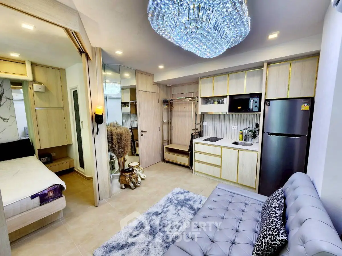 Luxurious modern studio apartment with elegant decor and open kitchen layout