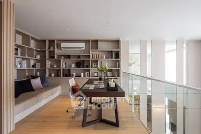 Modern study room with sleek desk and built-in shelves, perfect for productivity.