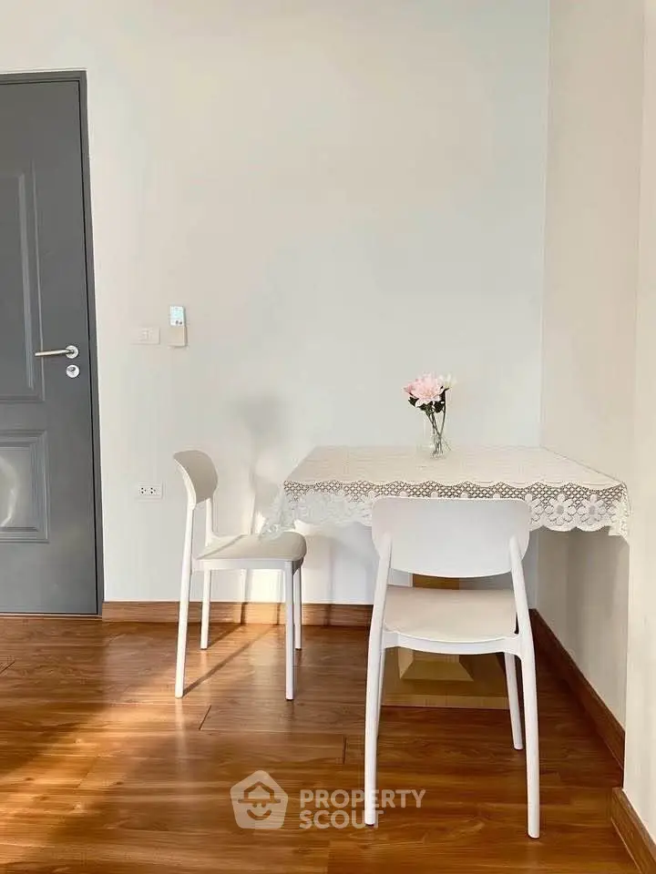 Cozy dining nook with wooden flooring and elegant decor