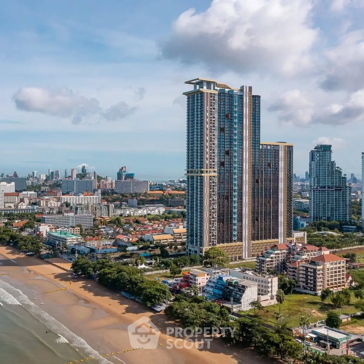 Stunning beachfront high-rise building with panoramic city and ocean views.