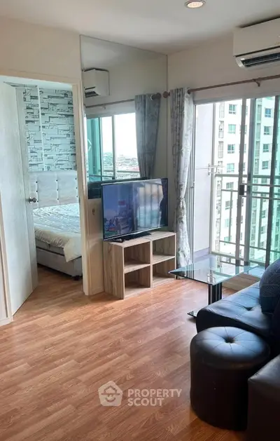 Modern living room with balcony view in high-rise apartment