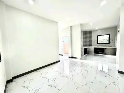 Spacious modern kitchen with marble flooring and sleek design