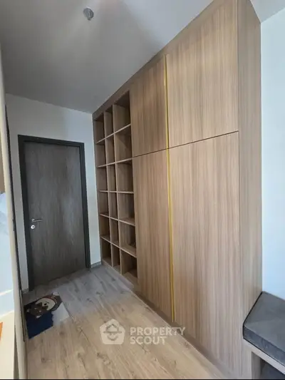 Modern storage room with wooden cabinets and open shelving