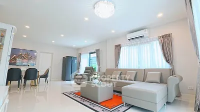 Spacious modern living room with elegant decor and ample natural light