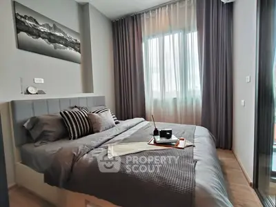 Modern bedroom with stylish decor and natural light