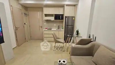 Modern apartment interior with compact kitchen and cozy living area