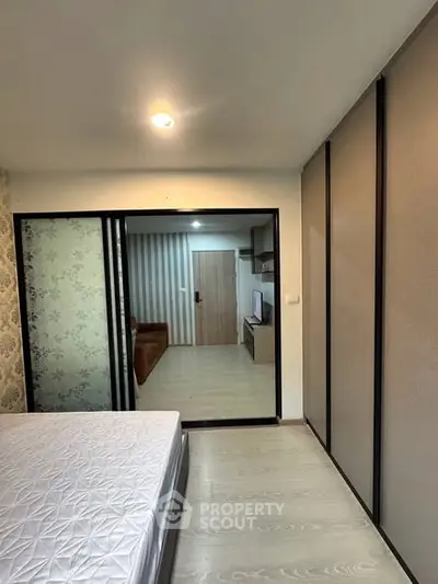 Modern bedroom with sliding glass doors and stylish decor