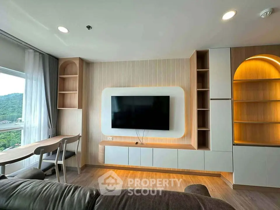 Modern living room with sleek TV setup and scenic window view