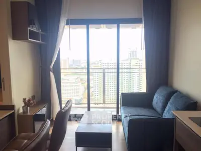 Modern living room with city view and cozy furniture in high-rise apartment
