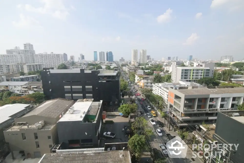 Stunning cityscape view from high-rise building showcasing urban skyline and bustling streets.