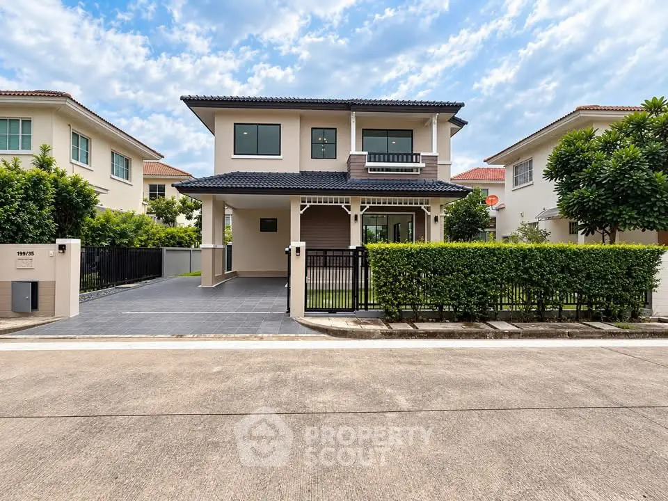 Stunning two-story house with modern design and lush greenery in a serene neighborhood.