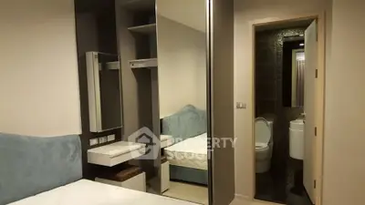 Modern bedroom with ensuite bathroom and stylish decor