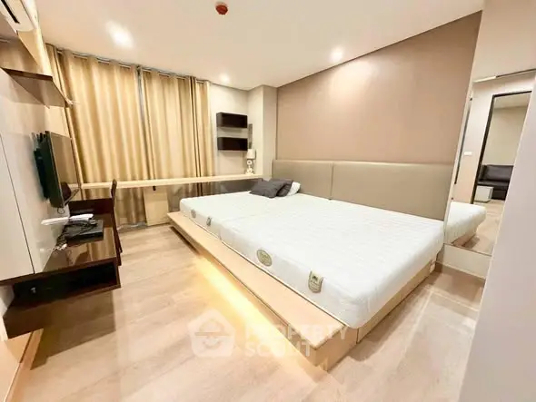 Spacious modern bedroom with sleek design and natural light