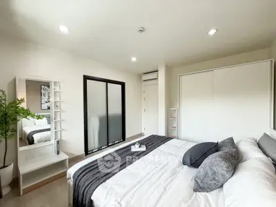 Modern bedroom with sleek design and ample natural light