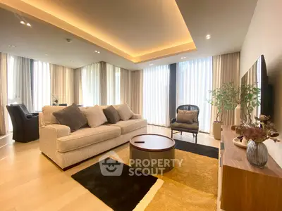 Luxurious modern living room with elegant decor and large windows