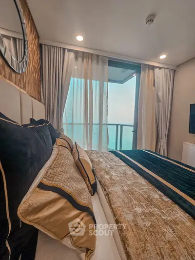 Luxurious bedroom with elegant decor and balcony view