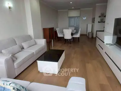 Spacious living room with modern furniture and elegant dining area