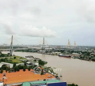 Stunning river view with iconic bridge and cityscape, perfect for urban living enthusiasts.