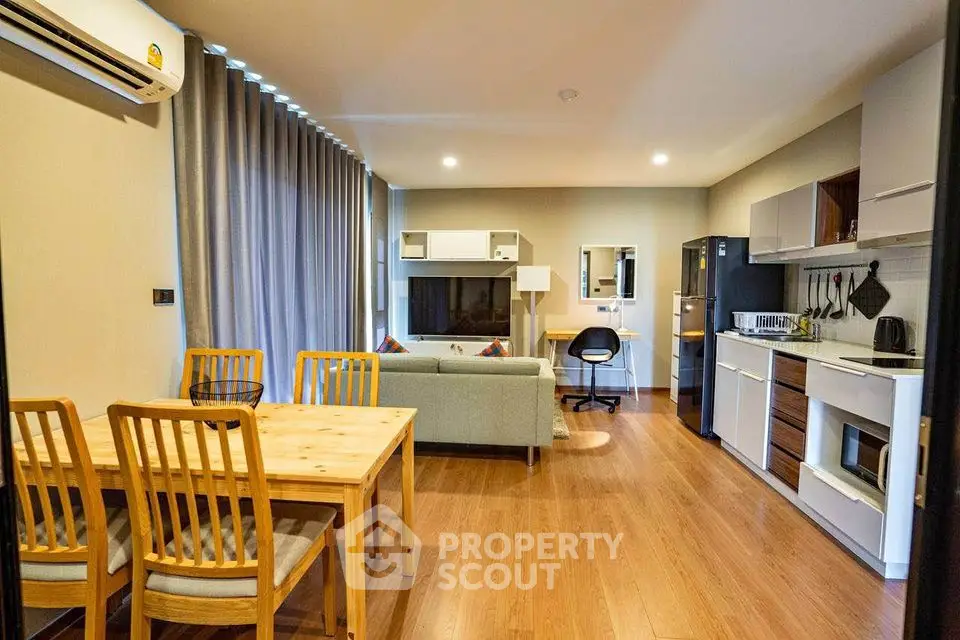 Spacious modern living room with open kitchen and stylish decor