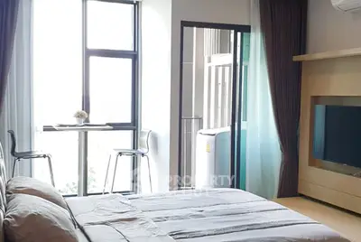 Modern bedroom with balcony access and natural light