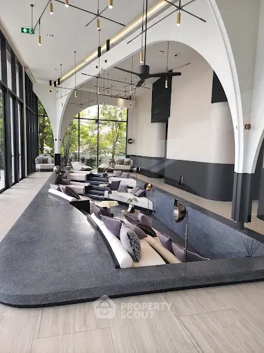 Luxurious modern living room with sunken seating and large windows