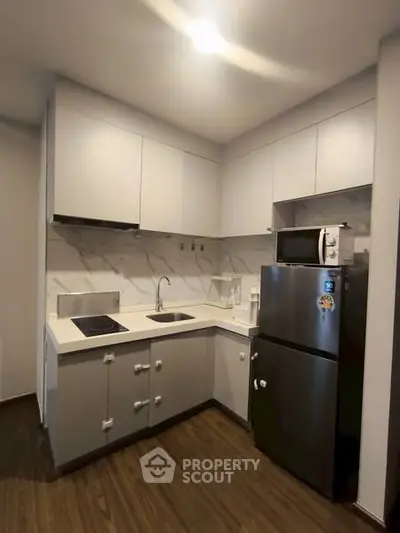 Modern kitchen with sleek cabinets and stainless steel appliances
