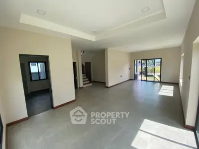 Spacious modern living room with large windows and open layout