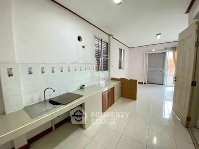 Spacious kitchen with sleek countertops and ample natural light