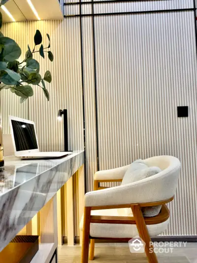 Modern home office with stylish chair and marble desk