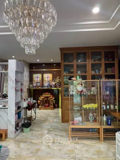 Luxurious living room with chandelier and elegant decor