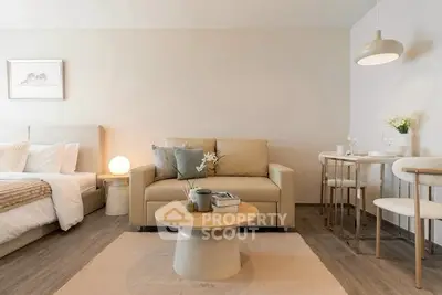 Modern studio apartment with cozy living area and stylish decor