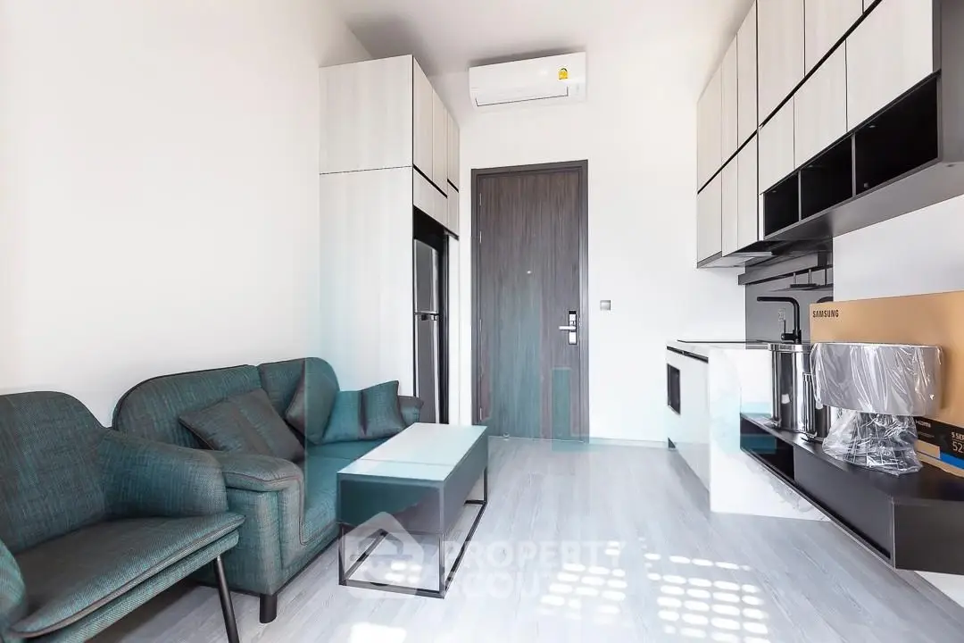 Modern living room with sleek furniture and integrated kitchen appliances