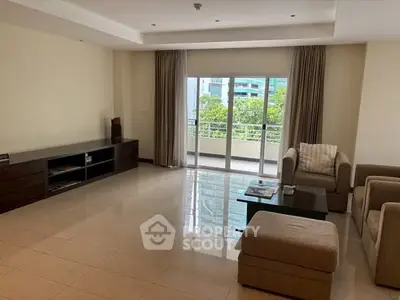 Spacious living room with modern furniture and balcony view