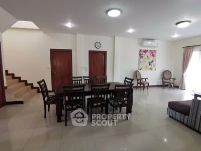Spacious living room with elegant dining area and stylish decor