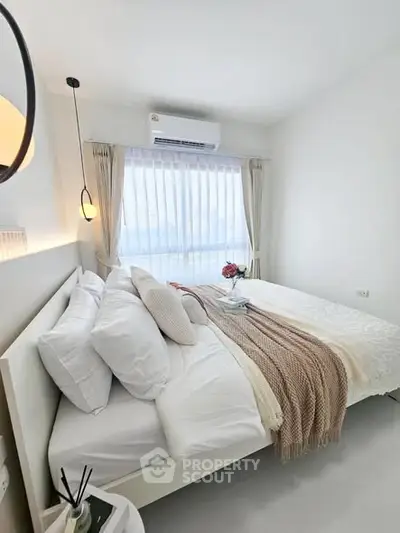 Bright and cozy bedroom with modern decor and natural light