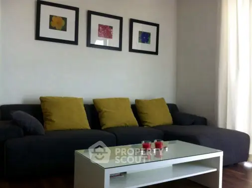 Modern living room with stylish sofa and art decor