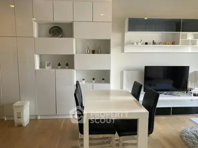 Modern living room with sleek white furniture and stylish decor