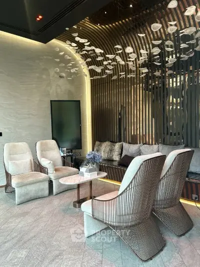 Luxurious modern living room with elegant seating and artistic ceiling decor