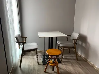 Cozy minimalist dining nook with modern chairs and natural light